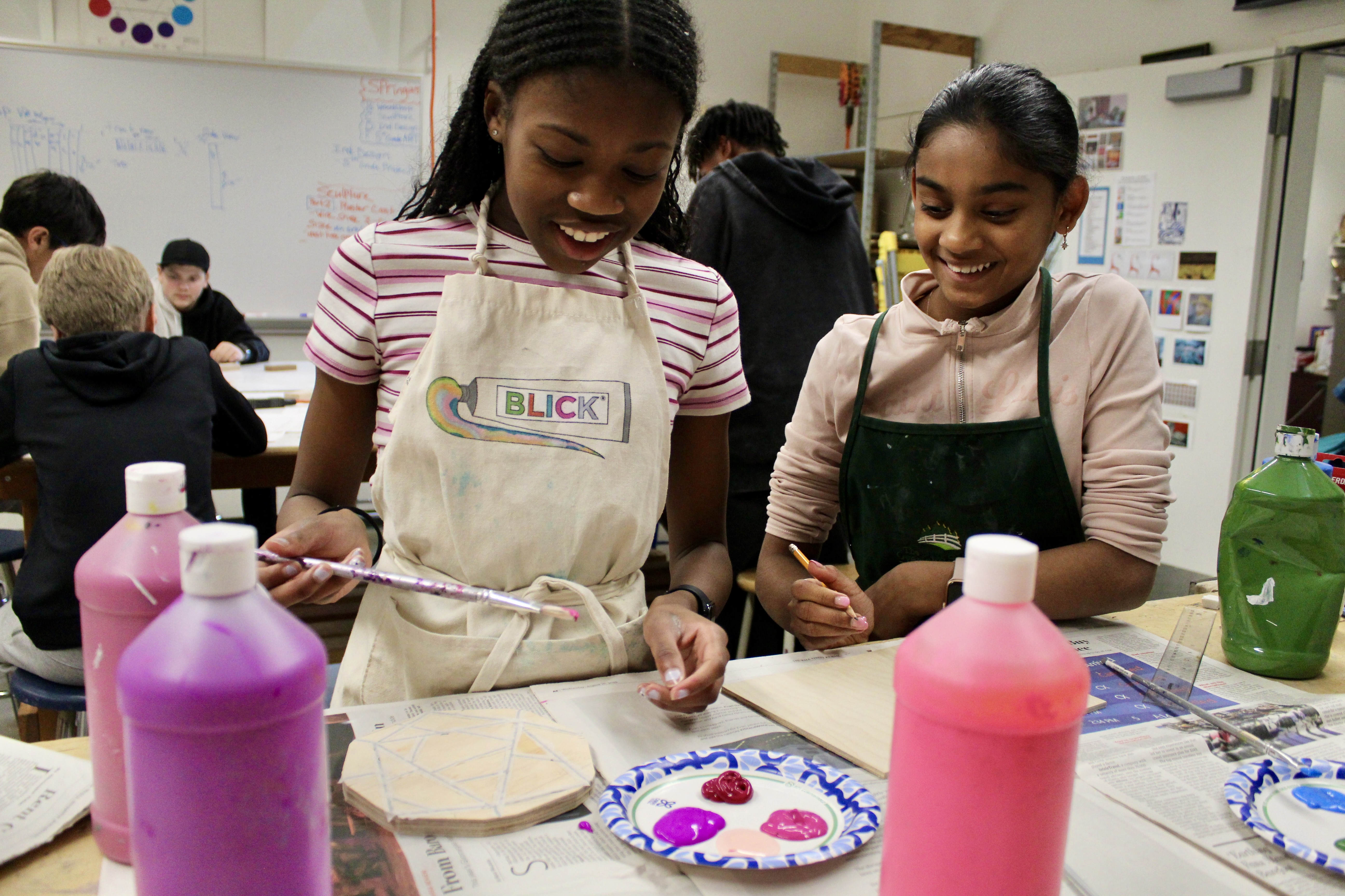 two students painting