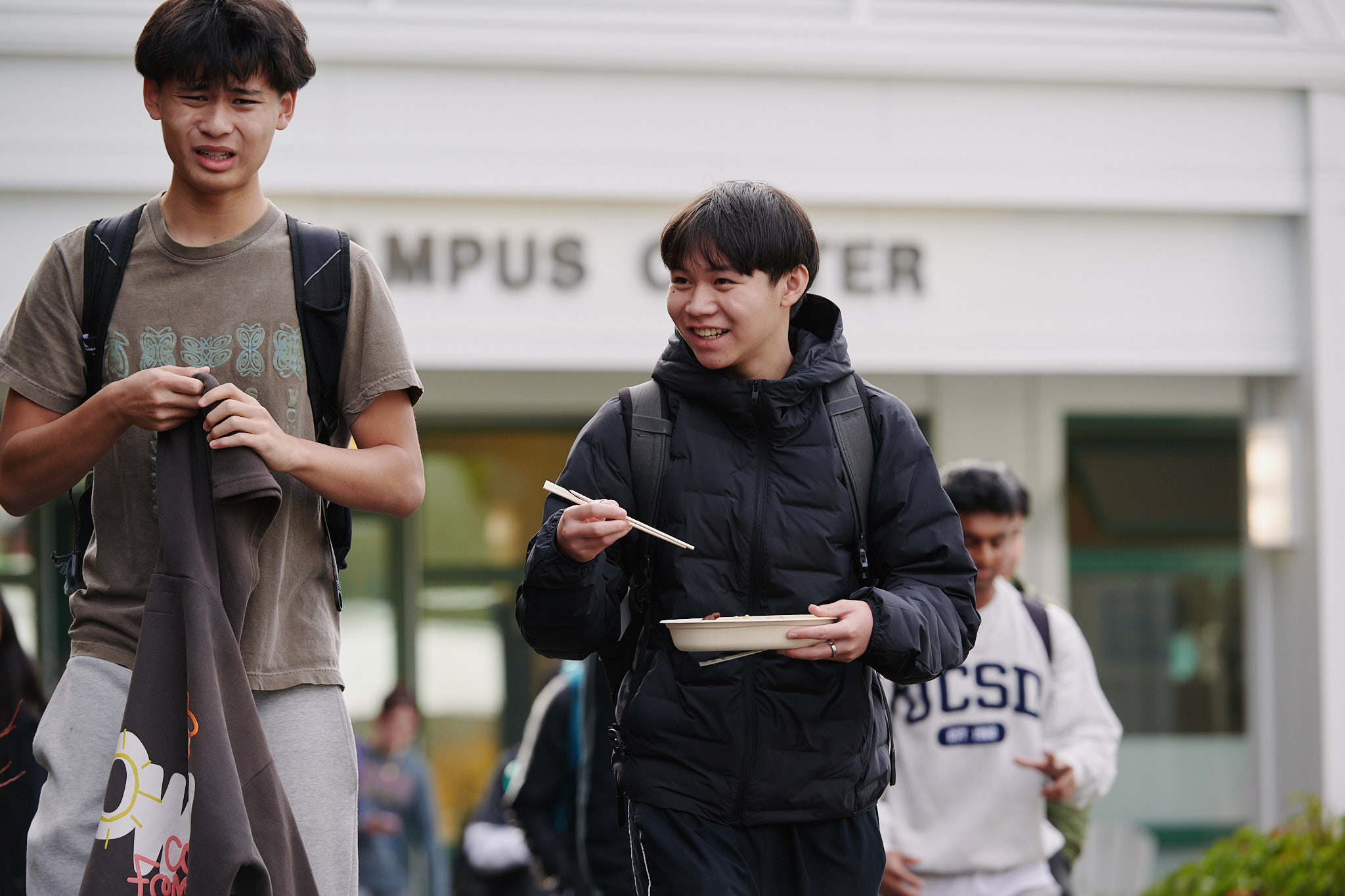 Upper school boys walking outside Campus Center