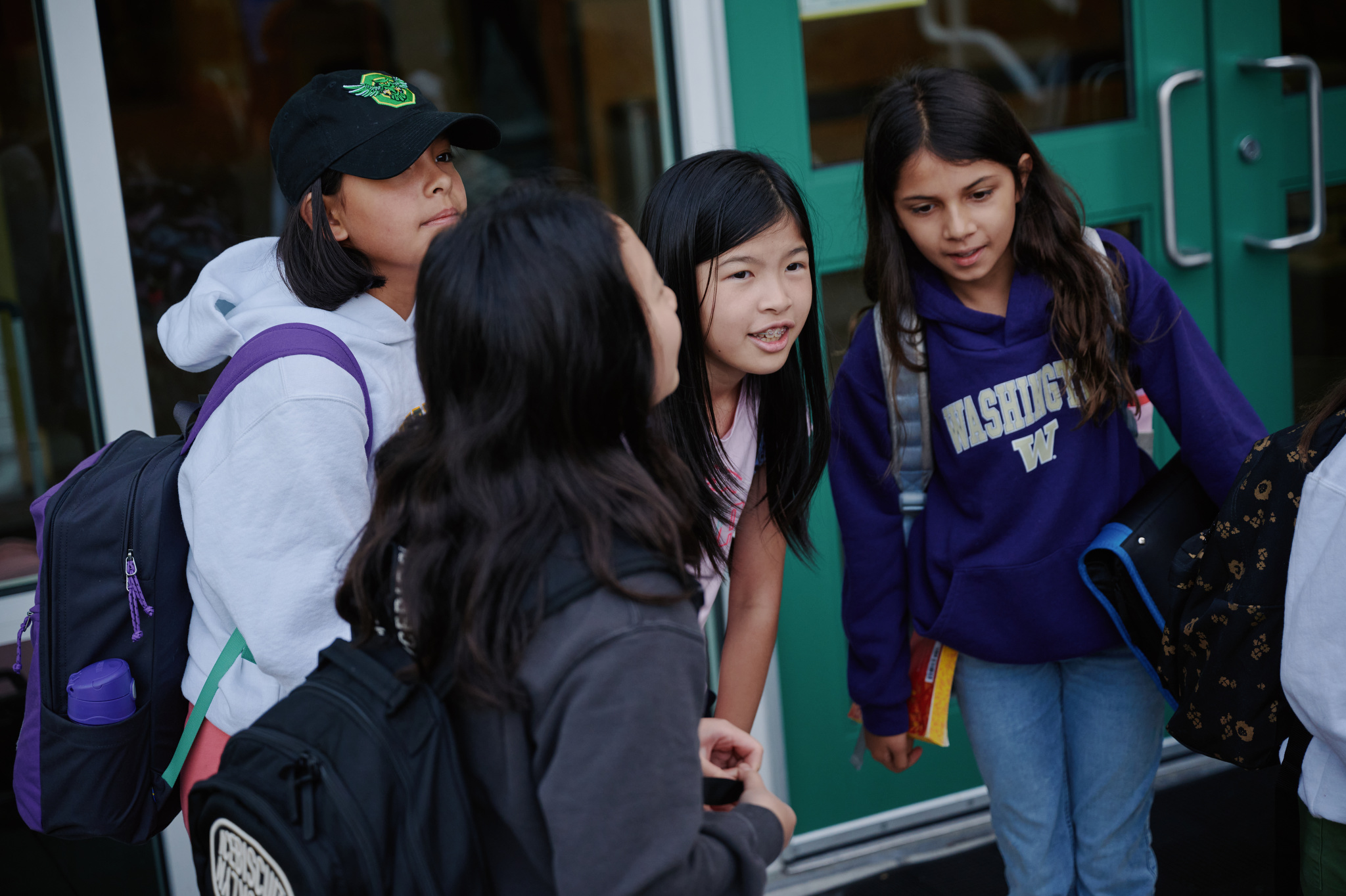 group of middle school girls outside doors