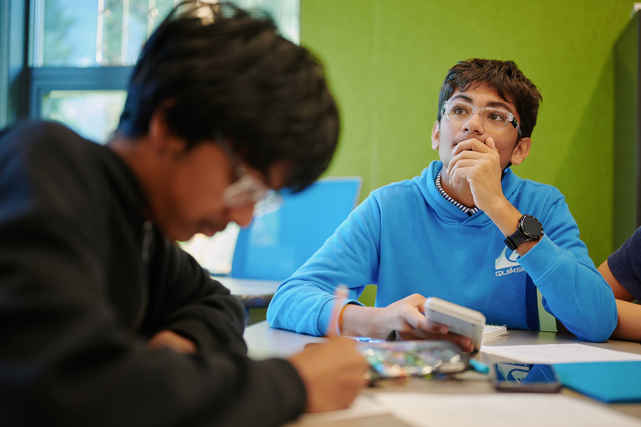 middle school boy thinking at desk