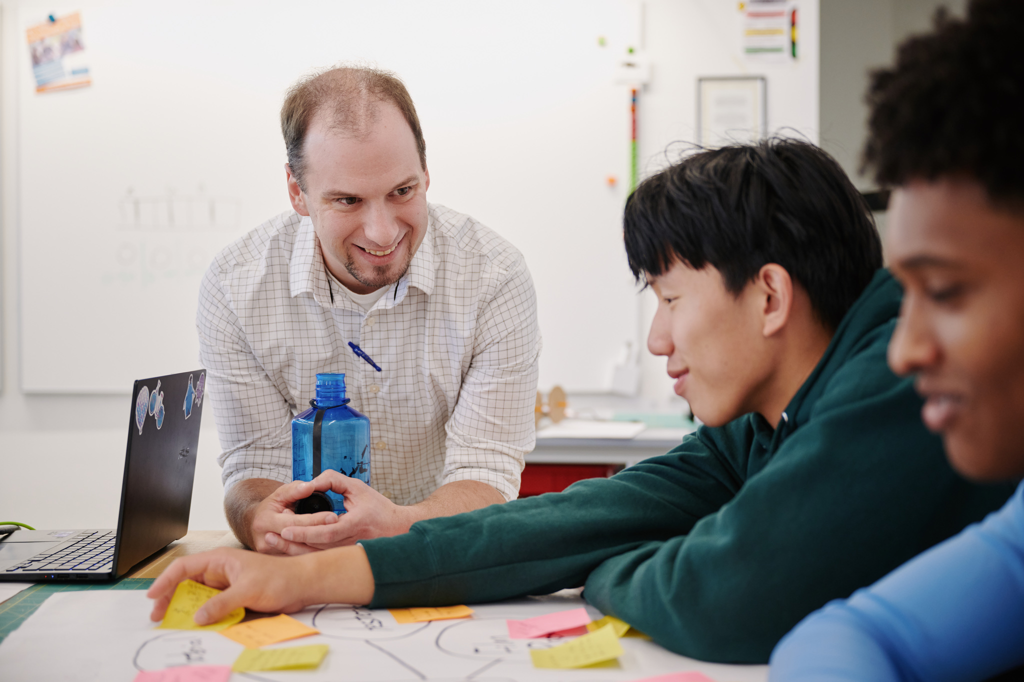 teacher talking with student in Idea lab