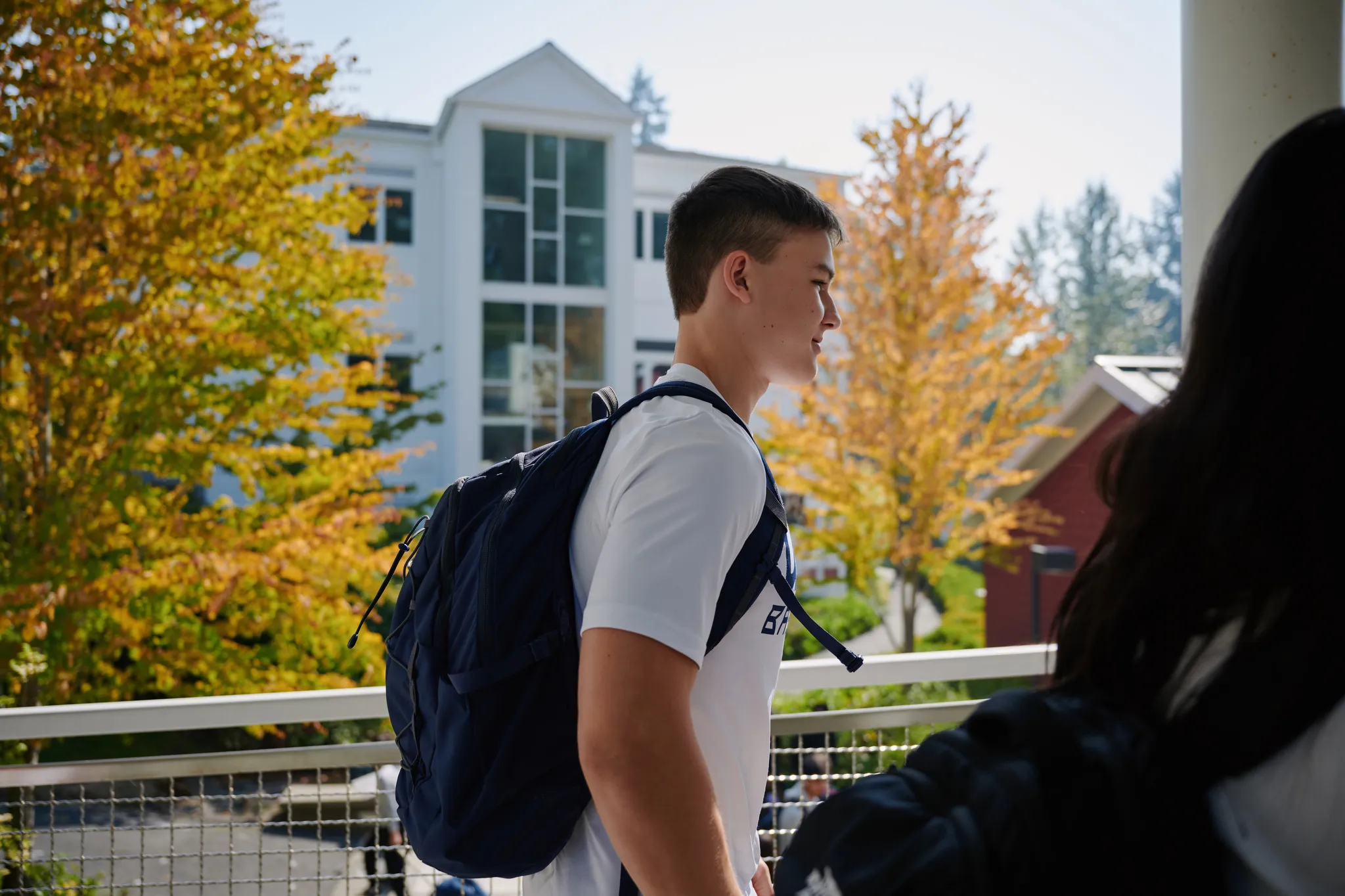 profile of upper school student walking by