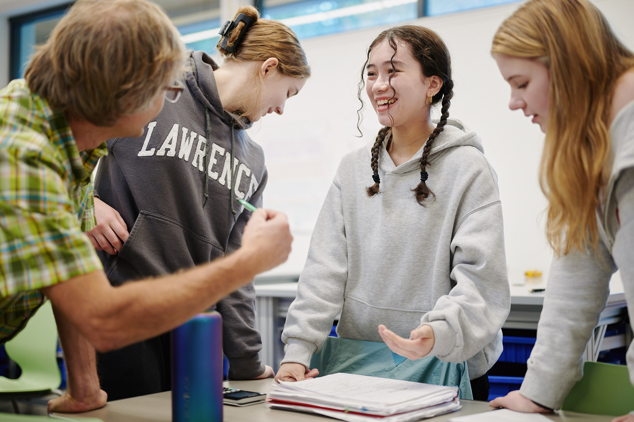 teacher looking at student's work