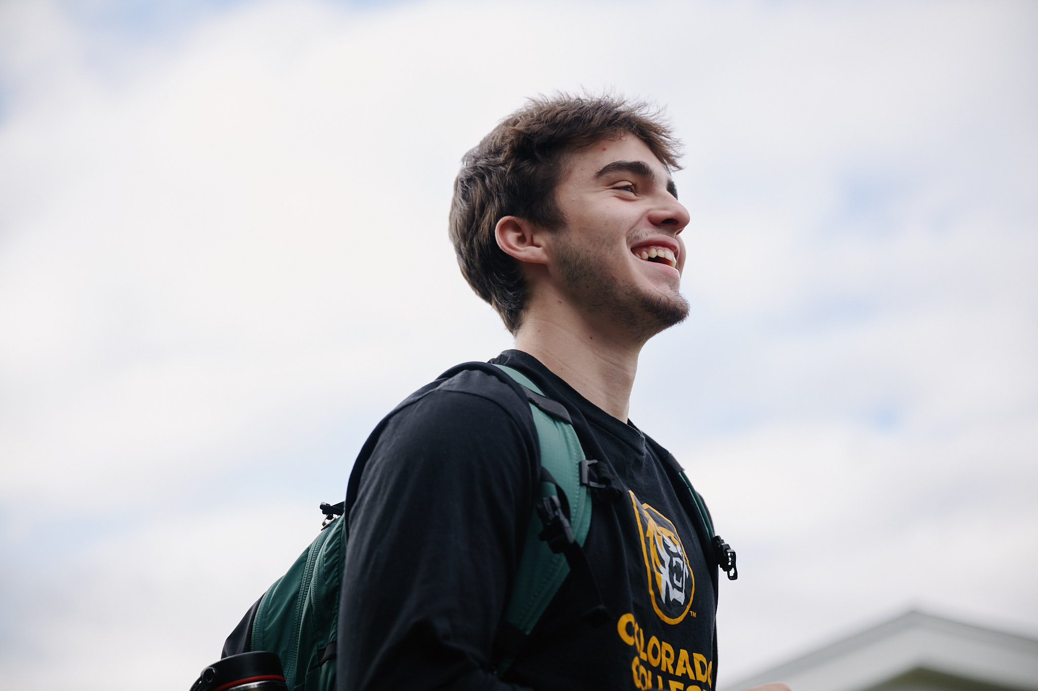 student outside laughing