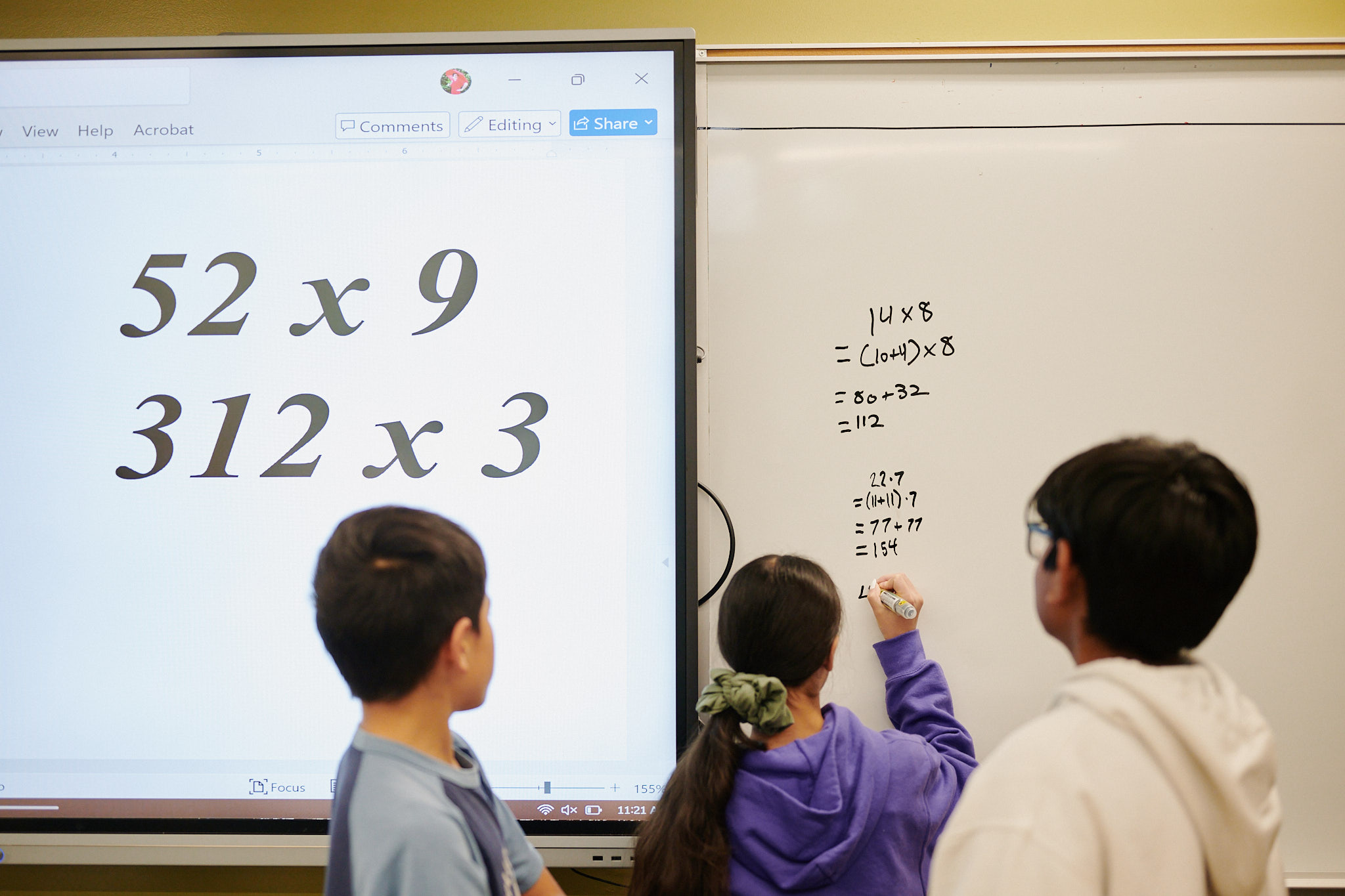 students doing mathwork at board