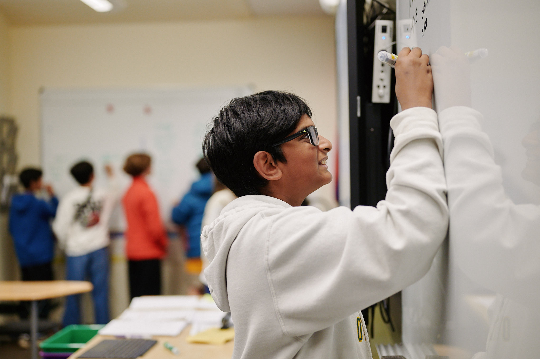 students doing mathwork at board