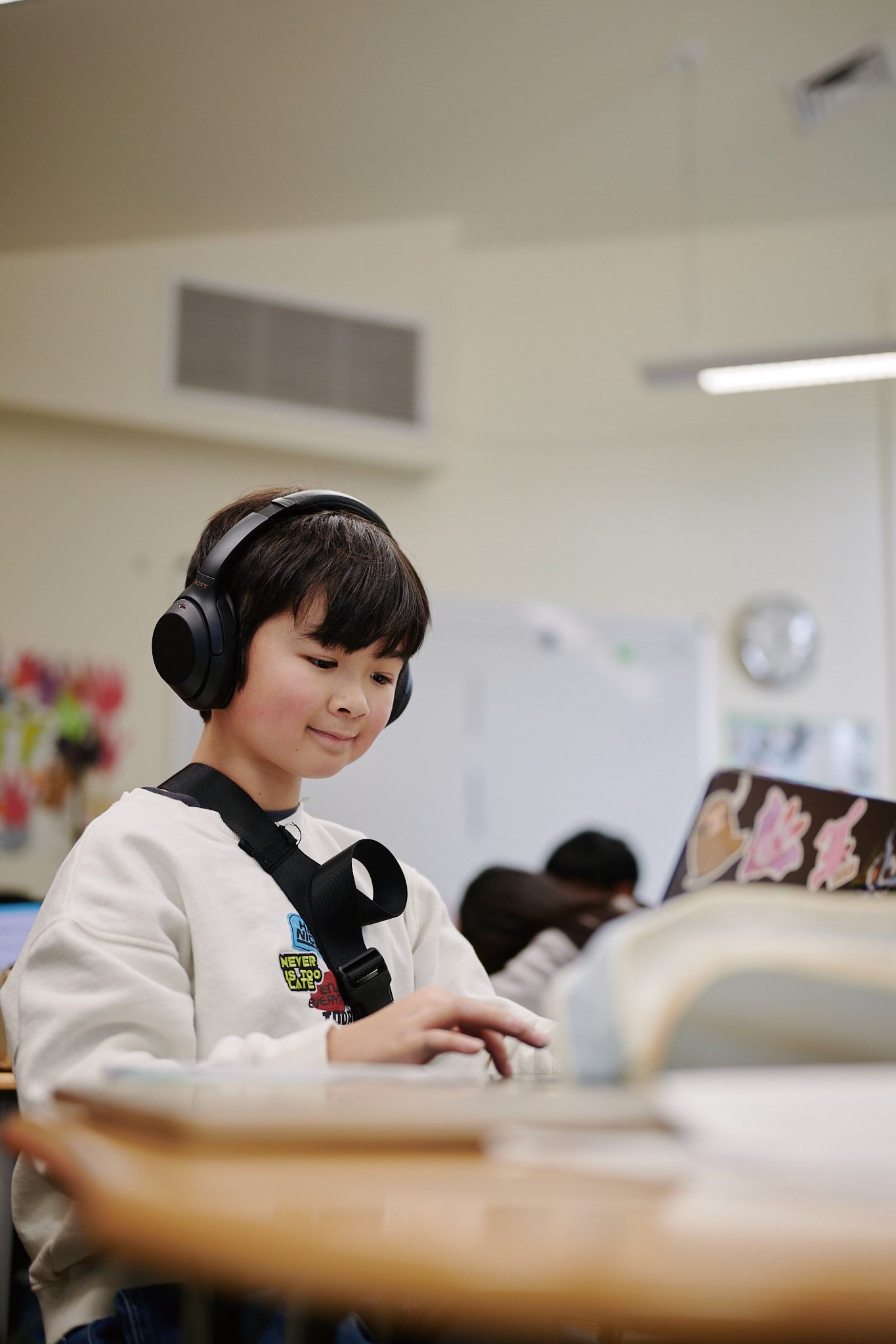 middle school student with headphones on