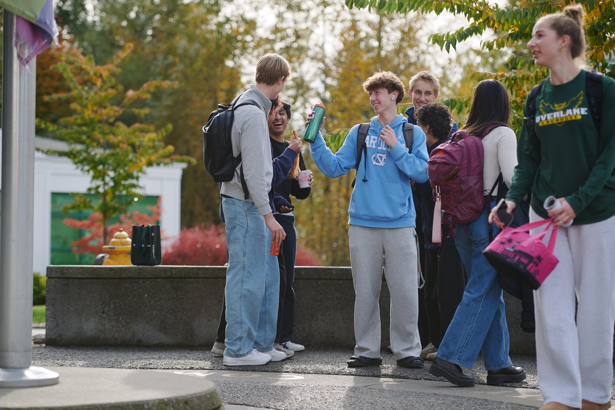 Upper School students outside flagpole