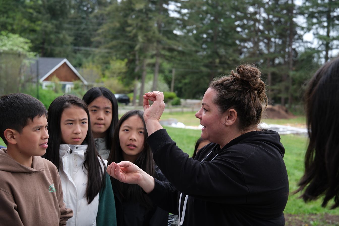 Students and faculty learning outdoors
