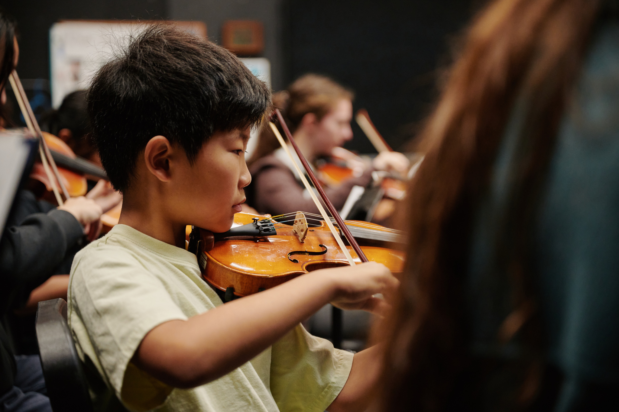 Middle school student playing violin