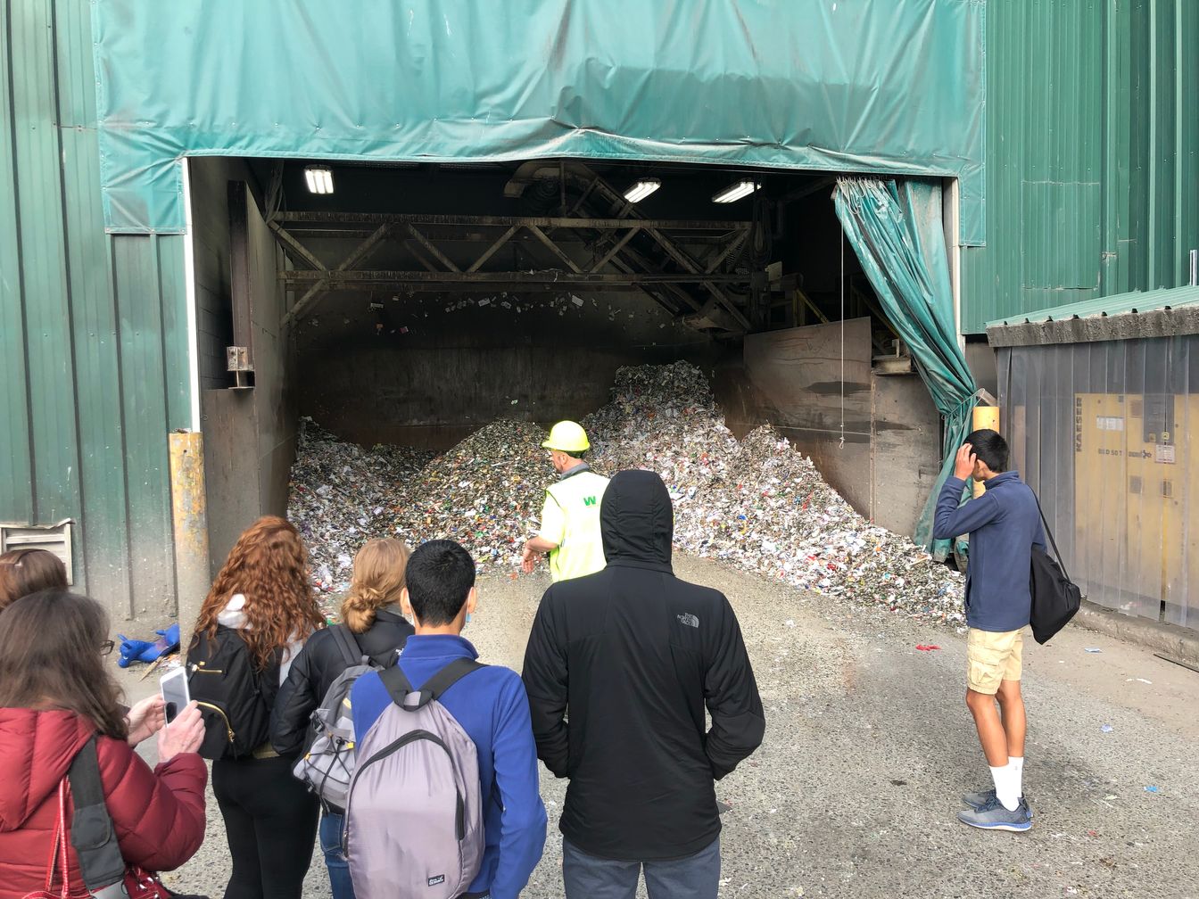 Students learning about waste management at the dump.