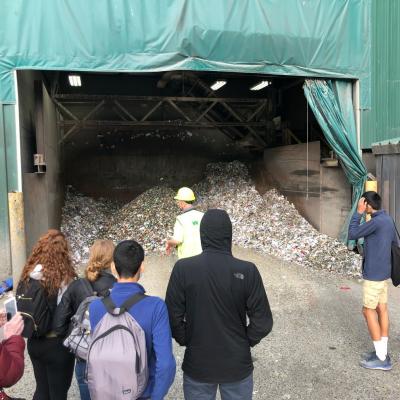 Students learning about waste management at the dump.
