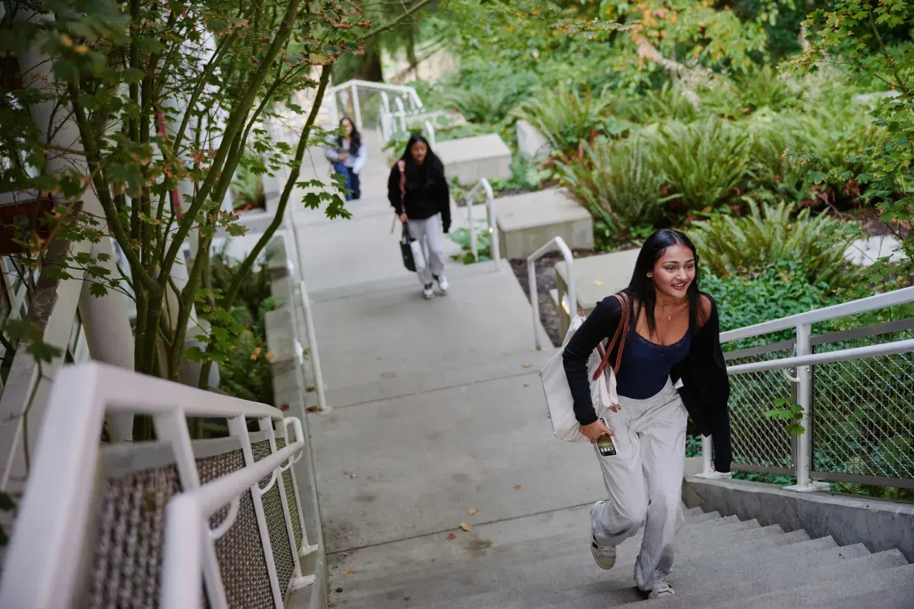several students walking up stairs