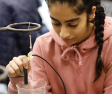 a girl doing a science experiment